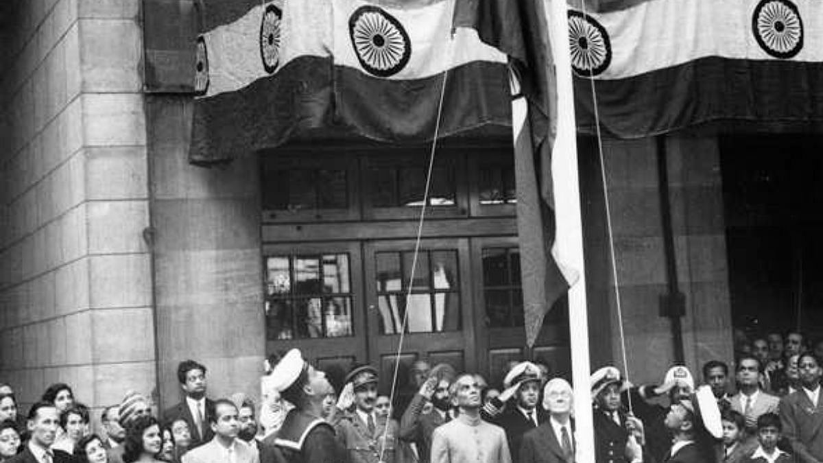 Amongst others watching the national flag of India being hoisted are the High Commissioner for India Krishna Menon in 1949.